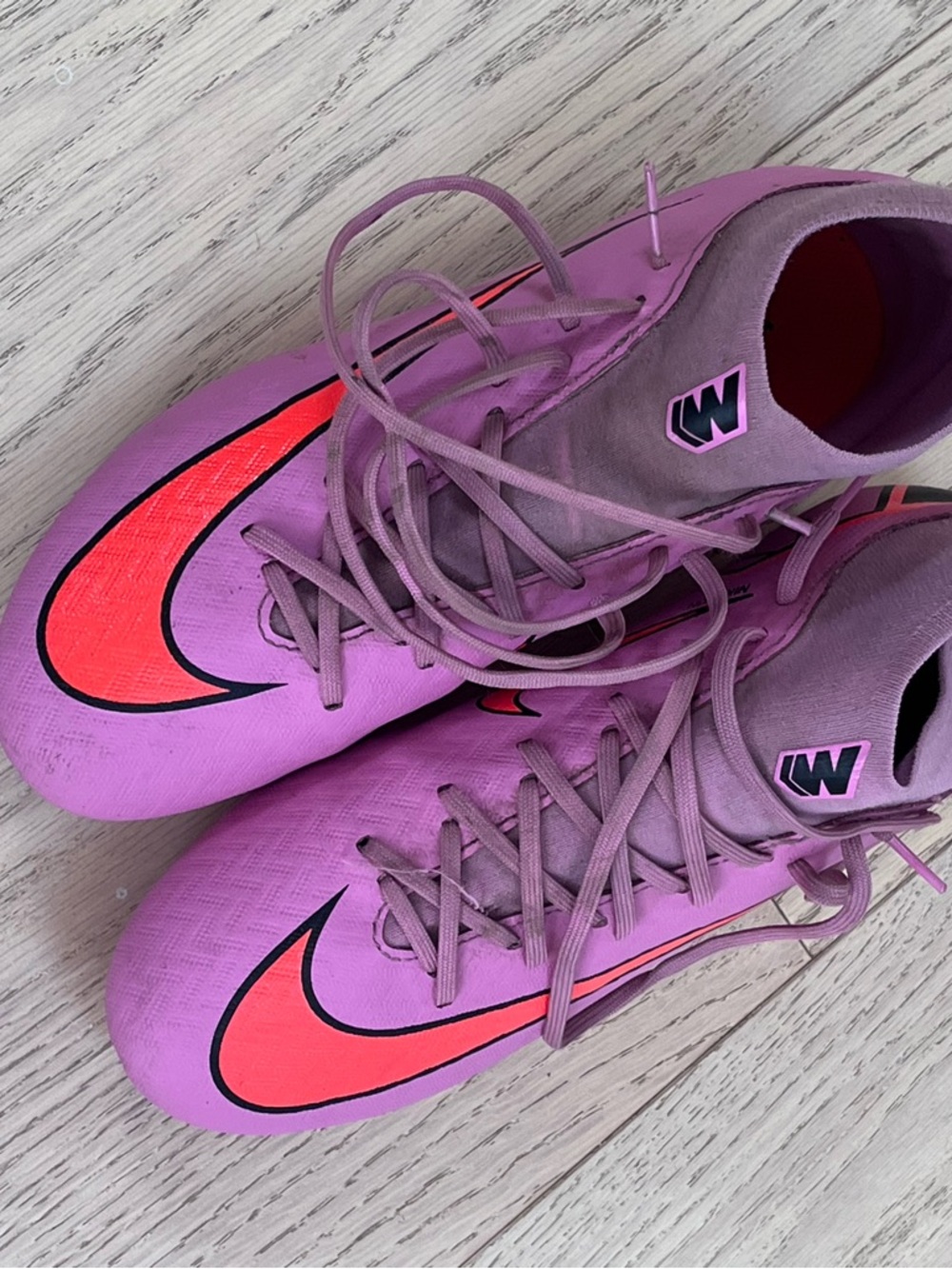 Nike Youth Pink Soccer Cleats with Orange Swoosh